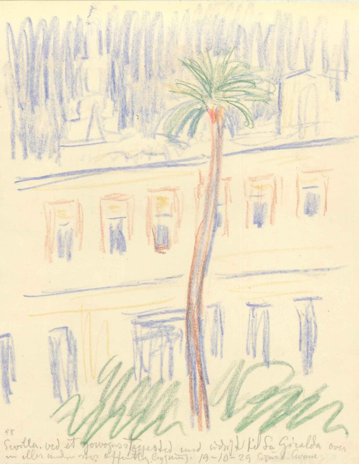 Bygningsfacade med palme i forgrund