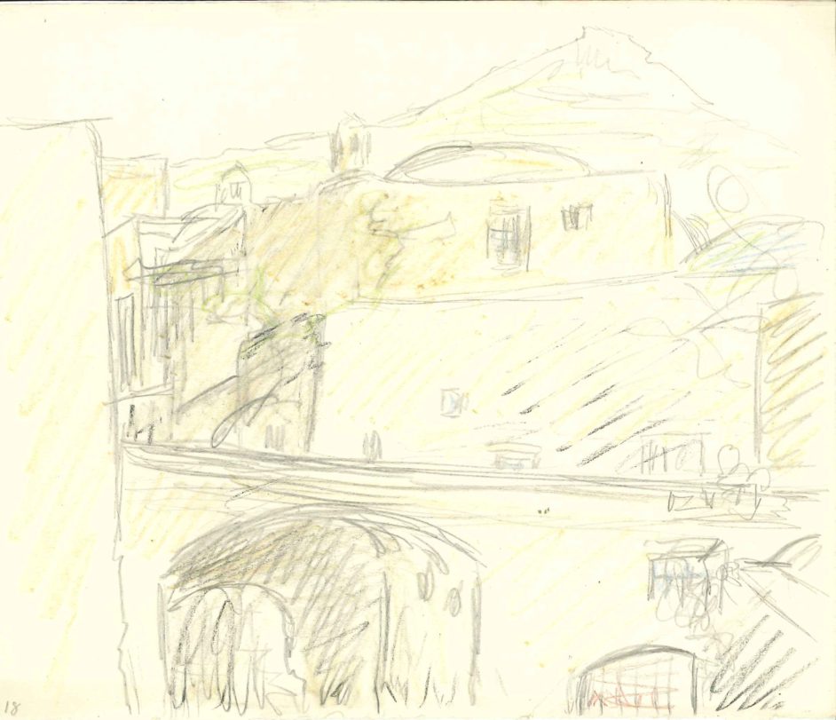 Udsigt over byense tage mod bjerg i baggrund