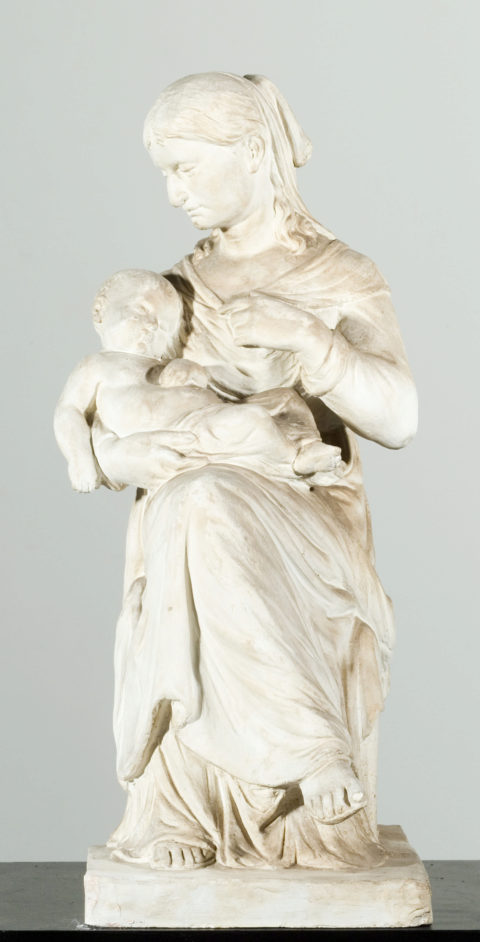 Siddende kvinde med barn